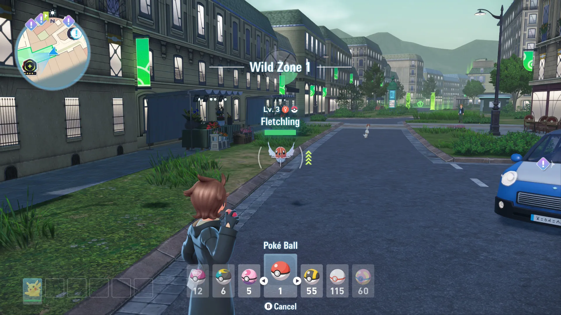 My player character in the process of throwing a Pokéball at a Fletchling.